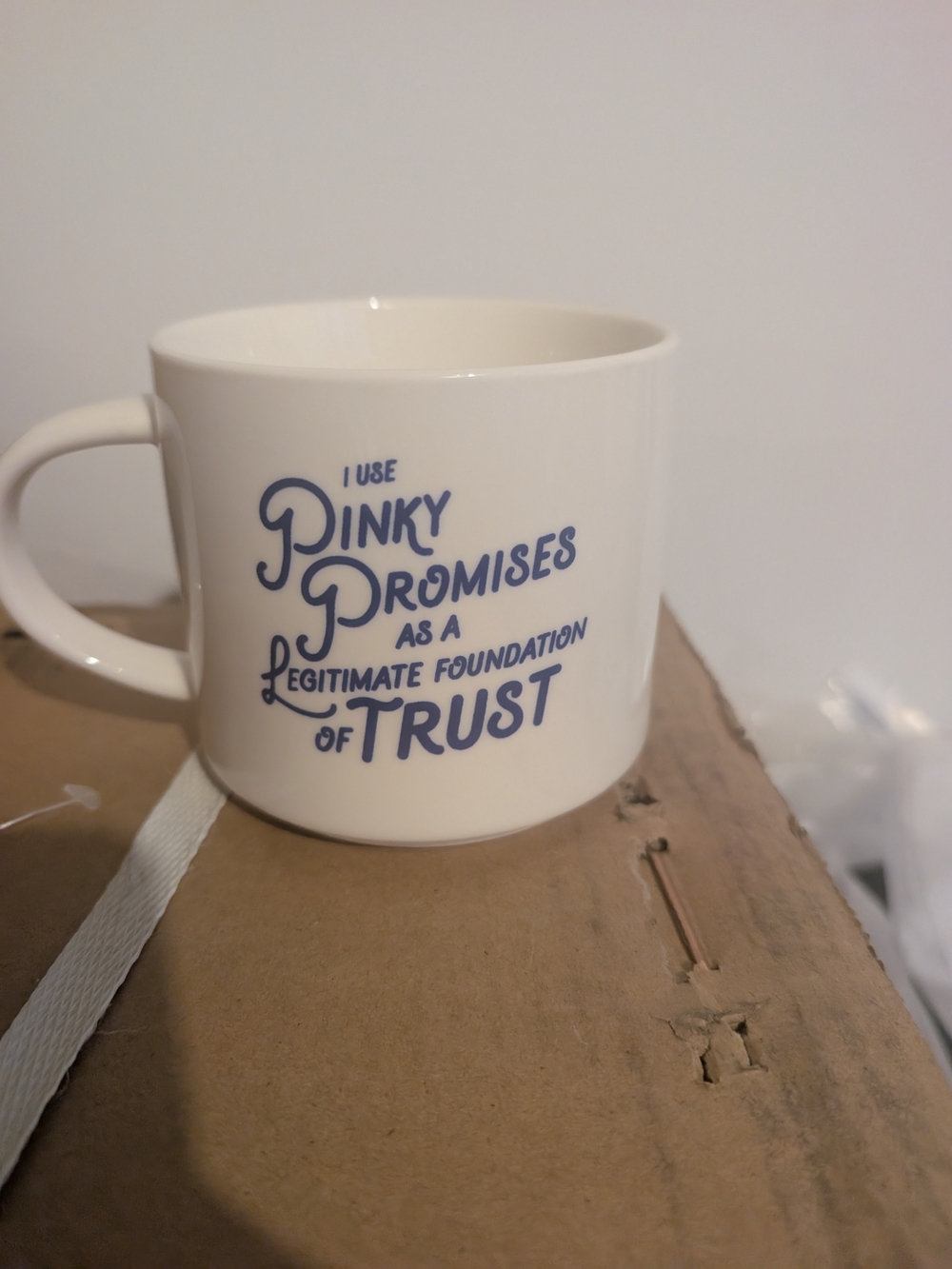 White Ceramic Mug with Blue Typography - Home Dining